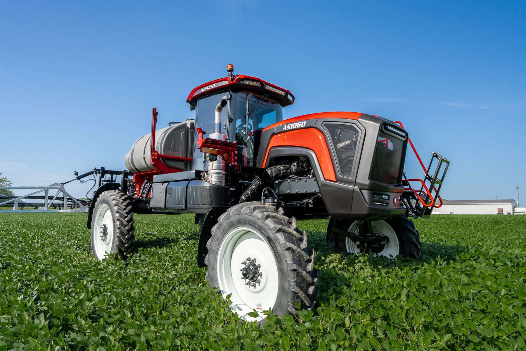 Apache AS1060 sprayer in a soybean field